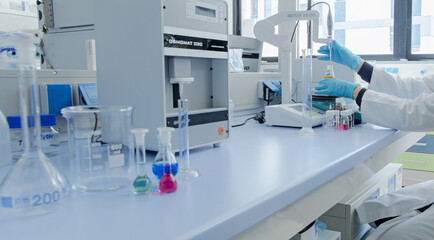 analysis, analyzing, background, biochemistry, biology, biotechnology, blue, bottle, chemical, chemical lab, chemical laboratory, chemist, chemistry, closeup, container, development, discovery, doctor