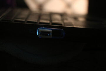 close up of a laptop on black background