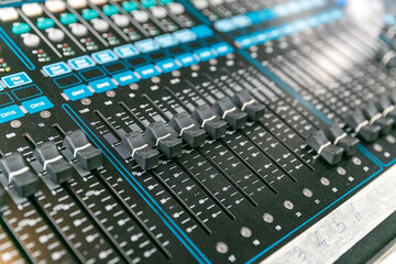 Sound audio mixer. General plan of sliders and buttons on a mixing console