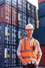 Dock control worker wear safety helmets and protect suite working and checking product with laplets in shipping container, commercial transport background.