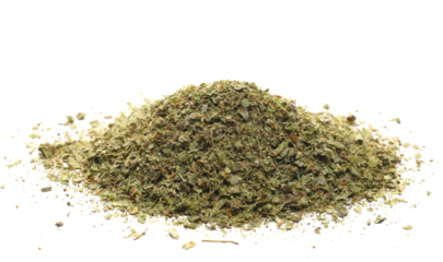 Dry chopped marjoram leaves isolated on white, side view