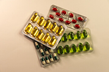 medicine capsules in plastic blister packs on a light background