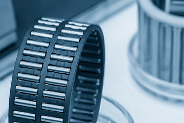 Close up scene the needle rolling bearing parts in light blue scene.