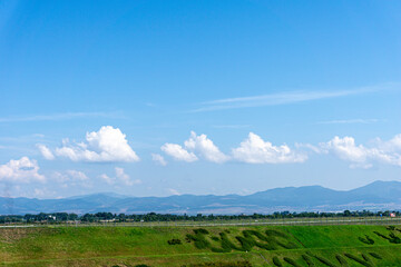 Landscape with blue sky and clouds
