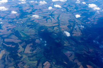 View to a land and clouds from airplane