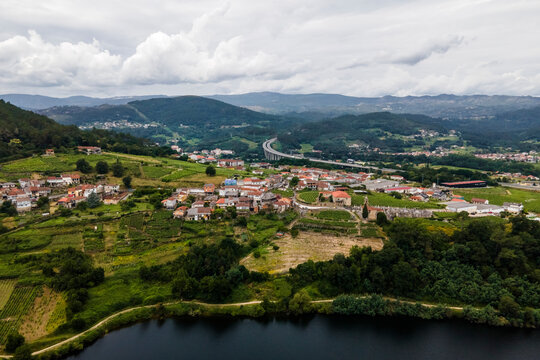 Aerial view of a small village along the Minho river in Val de Pereira, Ourense, Spain.