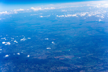 View to a land and clouds from airplane