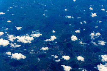 Obraz na płótnie Canvas View to a land and clouds from airplane