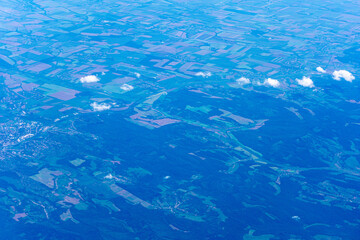 View to a land and clouds from airplane