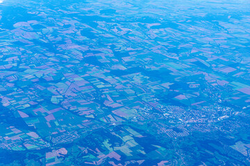 View to a land and clouds from airplane