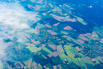 View to a land and clouds from airplane