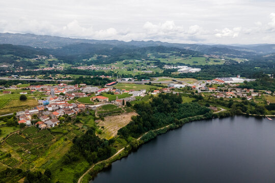 Aerial view of a small village along the Minho river in Val de Pereira, Ourense, Spain.