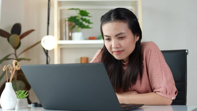 Asian women are spending their free time on vacation, doing hobbies, Watching sad tv series and movie or content on the computer with Emotions are amenable to the characters shown. Alone in the room