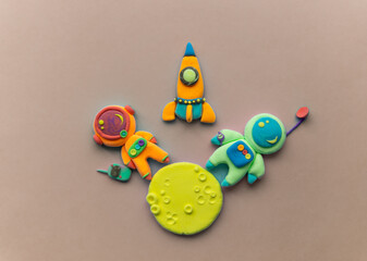 Astronauts On The Moon. Astronaut Is Made Out Of Play Clay. Spaceship, moon and two cute cosmonauts.