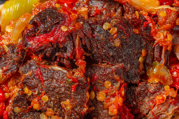 Jerado balado or Dendeng balado is a traditional cuisine from west sumatera, indonesia. it is made from slice of beef with spicy sauce called sambal.