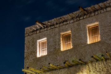 Souq Waqif old buildings in long exposure with moving clouds 