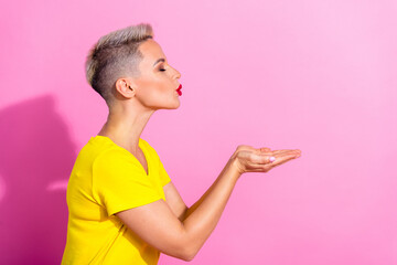 Profile portrait of lovely nice person closed eyes arms palms send air kiss empty space isolated on...