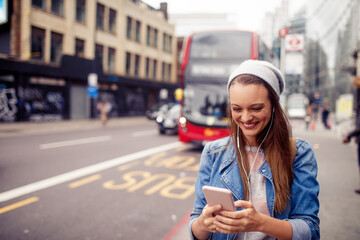 Young woman walking on the street in london
