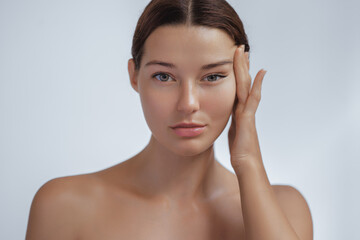 Obraz na płótnie Canvas Anti Aging Treatment and Facelift Skin Care Concept. Woman with hand on cheek and eye