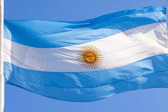 Argentinian Flag near Casa Rosada president office on historic Plaza de Mayo in Buenos Aires.
