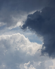 white storm clouds in sky background of nature. weather and climatic conditions, ecology. view of clouds from airplane window. Flight and freedom are religion. The top of sky and atmosphere, solar