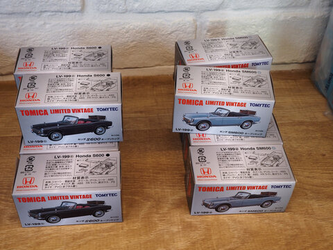 TOKYO, JAPAN - July 12, 2023: Boxes of toy limited edition Tomica versions of Honda vintage cars in a Honda showroom in Tokyo.