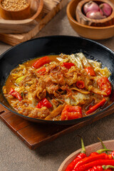 Tongseng is beef stew dish in curry-like soup, with vegetables and sweet soy sauce