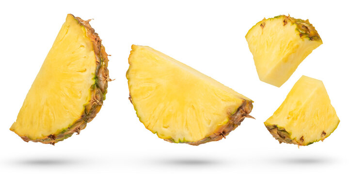 Ripe pineapple slices on a white isolated background. Pineapples of different ways of cutting. Pineapple isolate with remnants of peel of various shapes. To be inserted into a design or project.