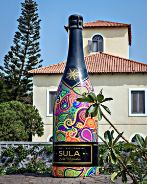 Nasik, India - November 18th, 2017: Big wine bottle sculpture made of cement displayed in the premises.