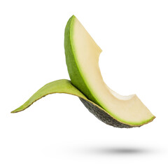 A slice of fresh avocado on a white isolated background. A slice of avocado with the skin partially...