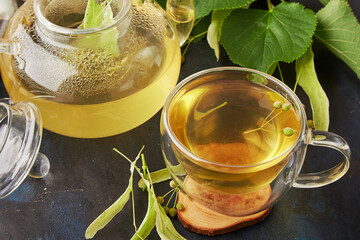 Cup of healthy natural linden, chamomile tea blossoms. Natural relaxing drink, benefits and...