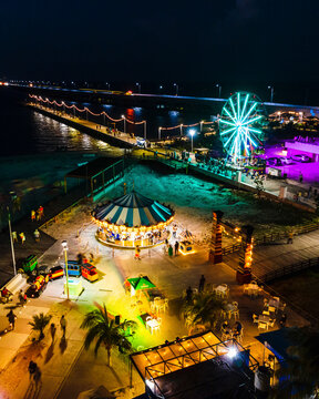 Aerial view of the Theme Park along the pier at night in Progreso, Yucatan, Mexico.