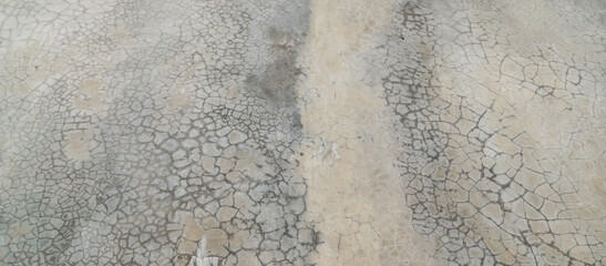 The texture of the old cement wall with silver paint, the background of the old wall of silver cement paint, taken from a close-up angle