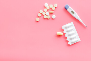 Medical treatment concept with thermometer pills and rectal suppositories