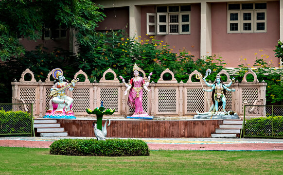 Shegaon,Maharashtra,India-September 22nd,2018: Statue deities of three Indian goddess on a stage in garden at Anand Sagar Complex