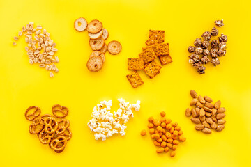 Pattern of many salty snacks top view. Fast food background