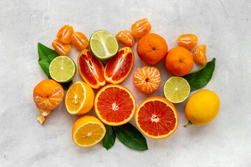 Freah fruits layout. Oranges grapefruits limes and other citrus fruits, top view