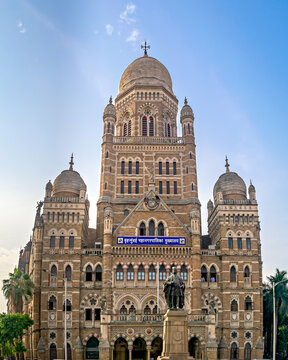 Mumbai, Maharashtra, India - April 19th, 2022:  Municipal Corporation Building with clear blue sky background, Mumbai. Translation of text on building is Mumbai Corporation Head Office.