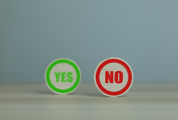 wooden block yes or no symbol and checkmark Alternative concepts, decision making, and true and false test questions.