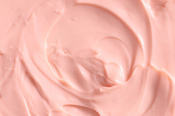 Pink skin care cosmetic beauty cream texture background in close up