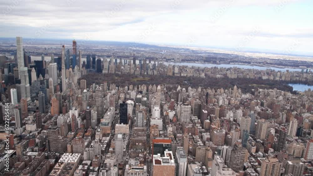 Wall mural new york city aerial view from helicopter in slow motion. midtown skyline and central park