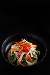 Japanese salad isolated in black background