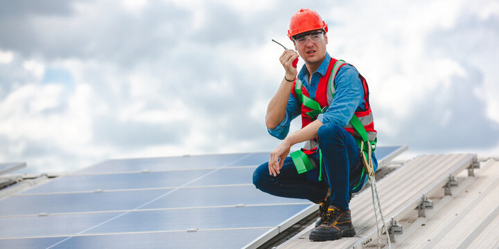 Elegant engineer holding a walkie talkies to working in determined and has a vision like a leader, Discussion and coordination between departments about problem solving, blue collar concept