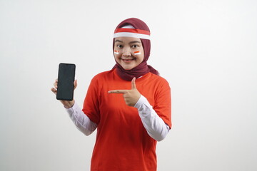 Hijab Woman indonesian independence day with pointing phone
