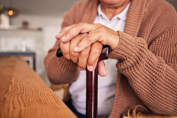 Closeup, hands and cane of person with disability, arthritis and aid of osteoporosis, parkinson or...
