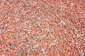 Crushed red brick as a texture background of natural materials