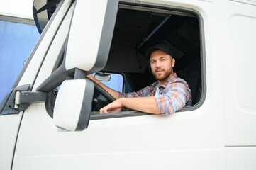 Close up of truck driver behind steering wheel. Copy space.