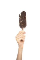 Ice cream covered with chocolate and almonds sticks in hand isolated on white background.