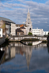Fototapeta na wymiar Cityscape of cork city with holy trinity church and lee river. Ireland Europe