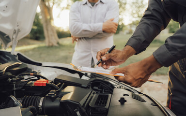 mechanic checking engine security testing tools before customers travel far